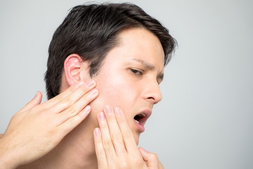 causes of TMJ pain and symptoms
